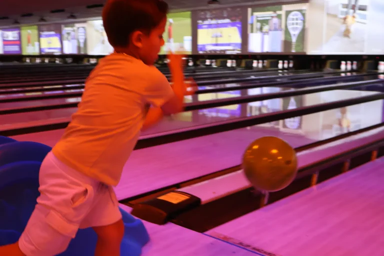 A boy following through after his throw