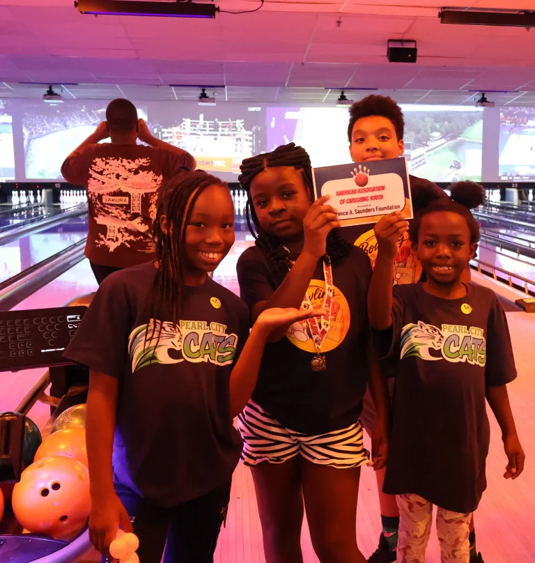 Children holding up their team certificate