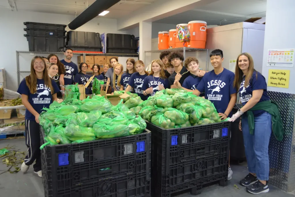 Student group packing produce bags