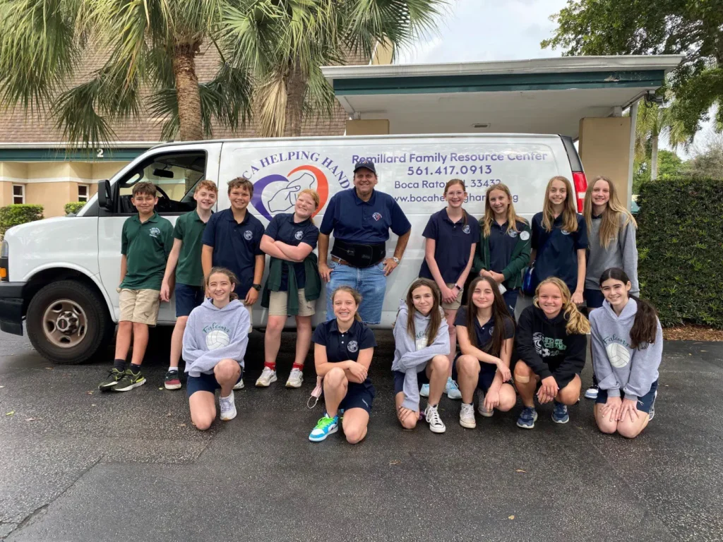 Students from a school food drive with the Boca Helping Hands van