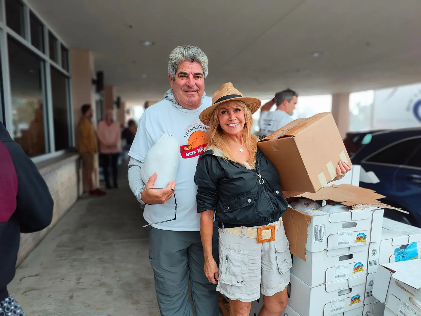 Volunteers loading filled Thanksgiving boxes