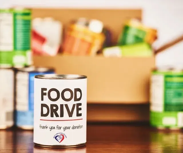 Volunteers sorting donated food at a food drive