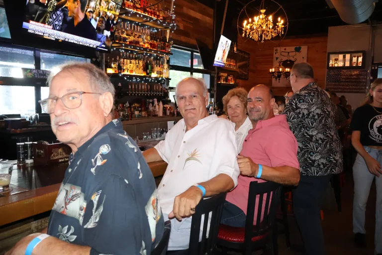 Guests seated along the bar