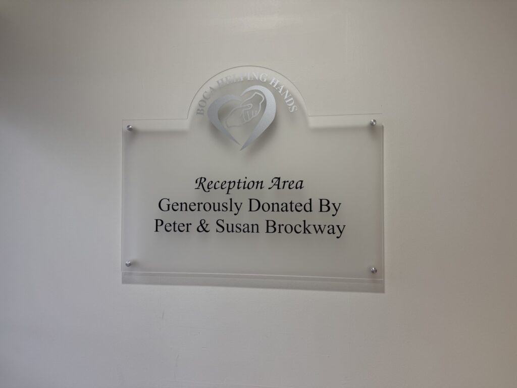 A donor recognition wall in the Boca Helping Hands lobby