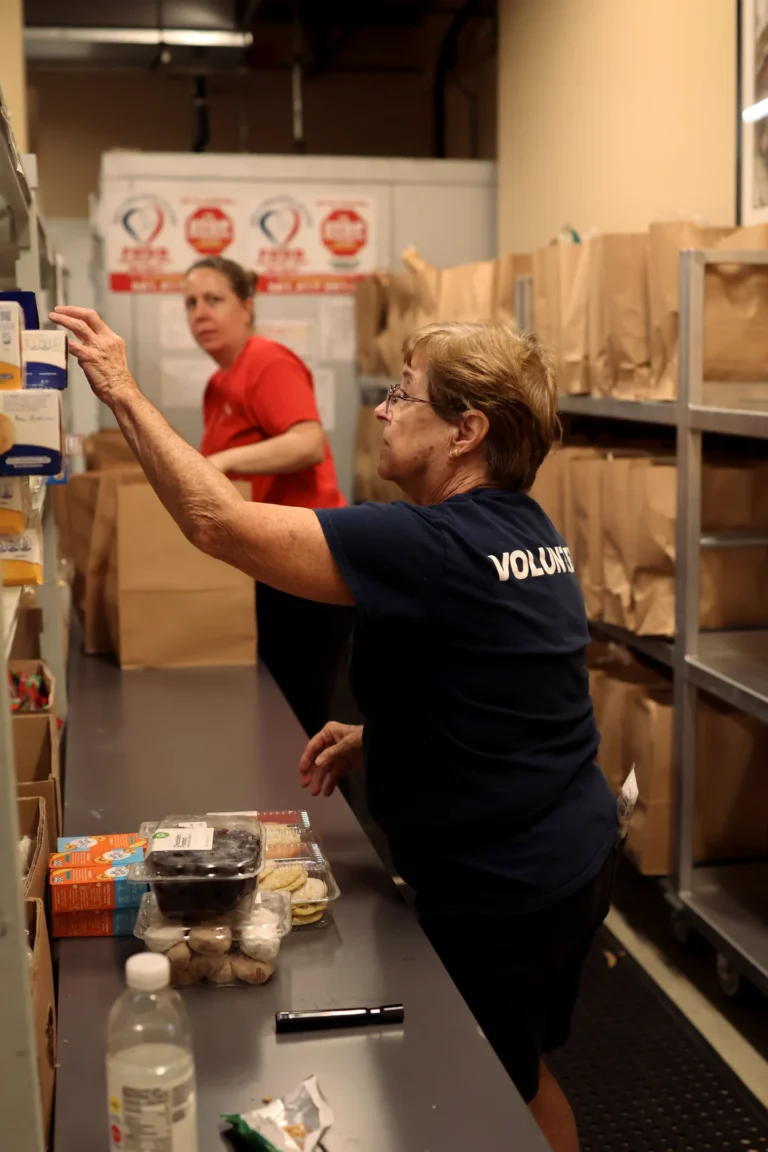 Volunteer at the pantry client check-in desk