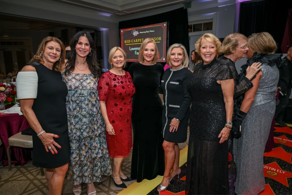 Four women smiling in the Boca Helping Hands food center