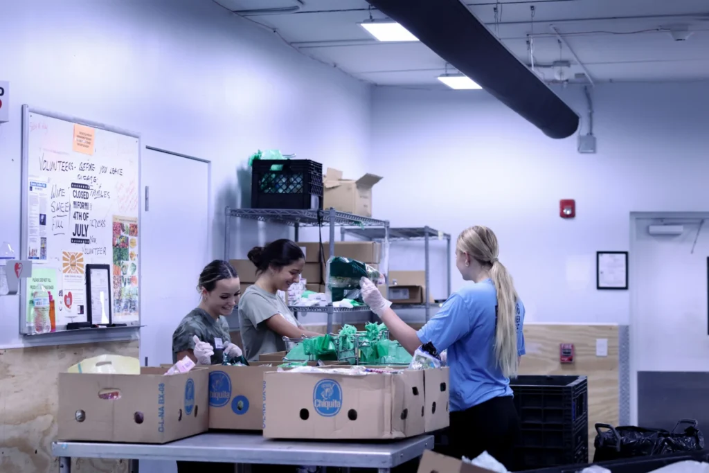Kitchen volunteers preparing hot meals
