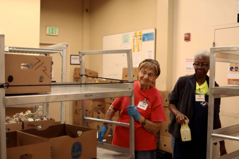 Kitchen volunteers preparing hot meals