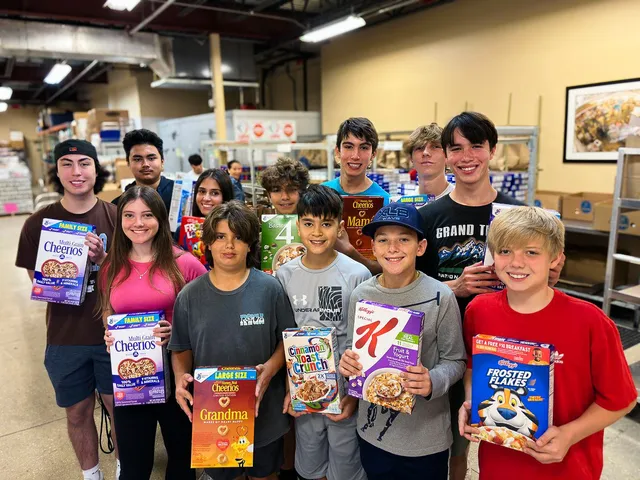 Students from a school food drive with the Boca Helping Hands van